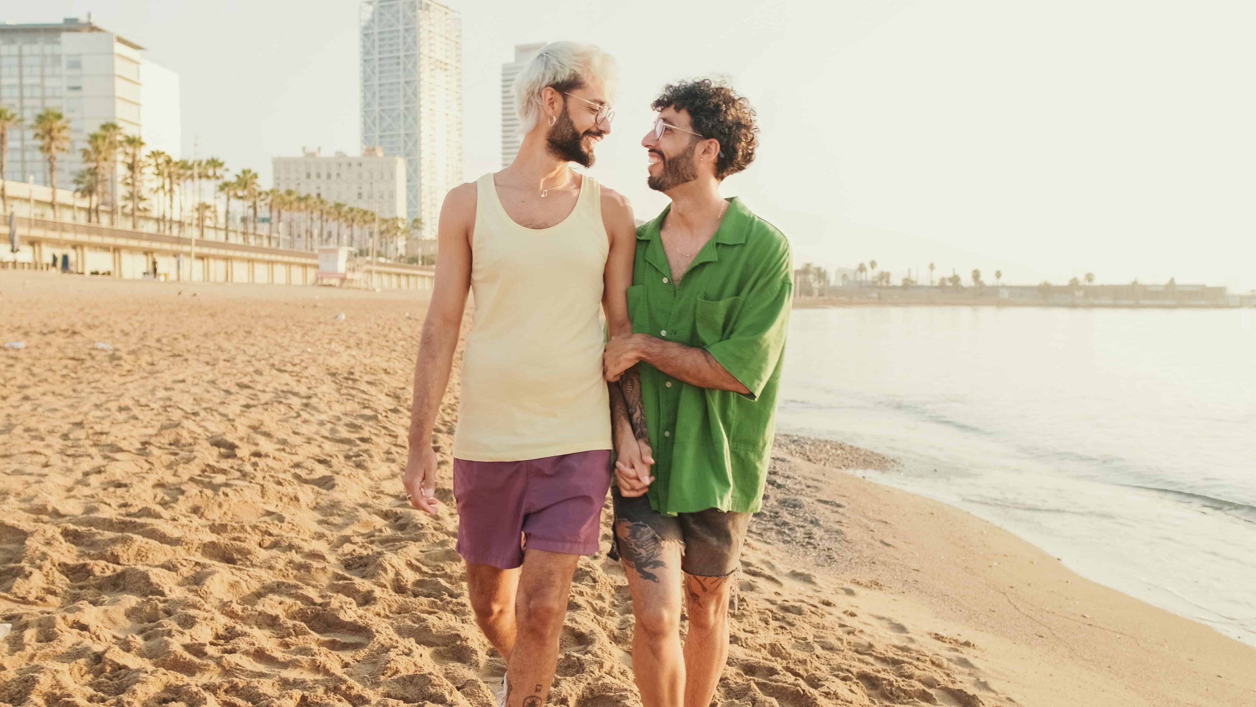 happy-gay-couple-walking-on-the-beach